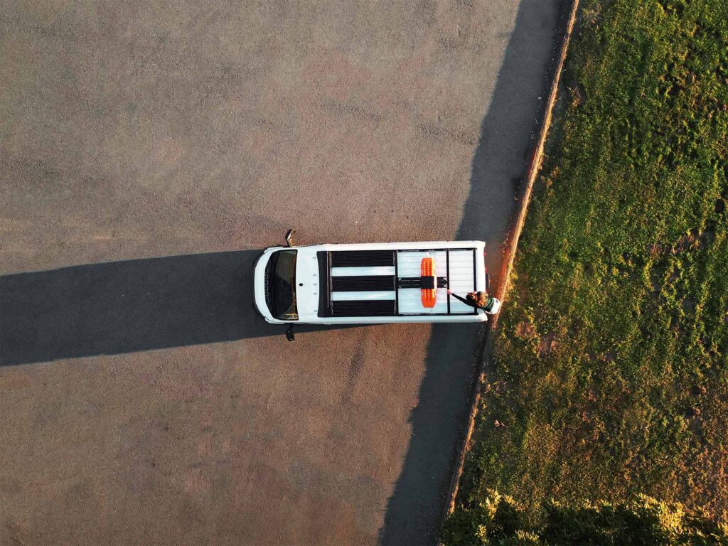 Tod-down view of a Promaster van featuring Aluminess Cruiser Modular Roof Rack