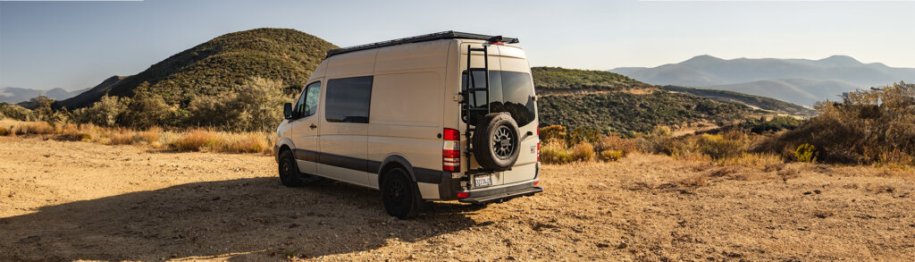 Sprinter van with Aluminess Tire Rack.